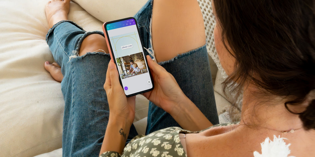 mother sitting on couch filling out template on phone